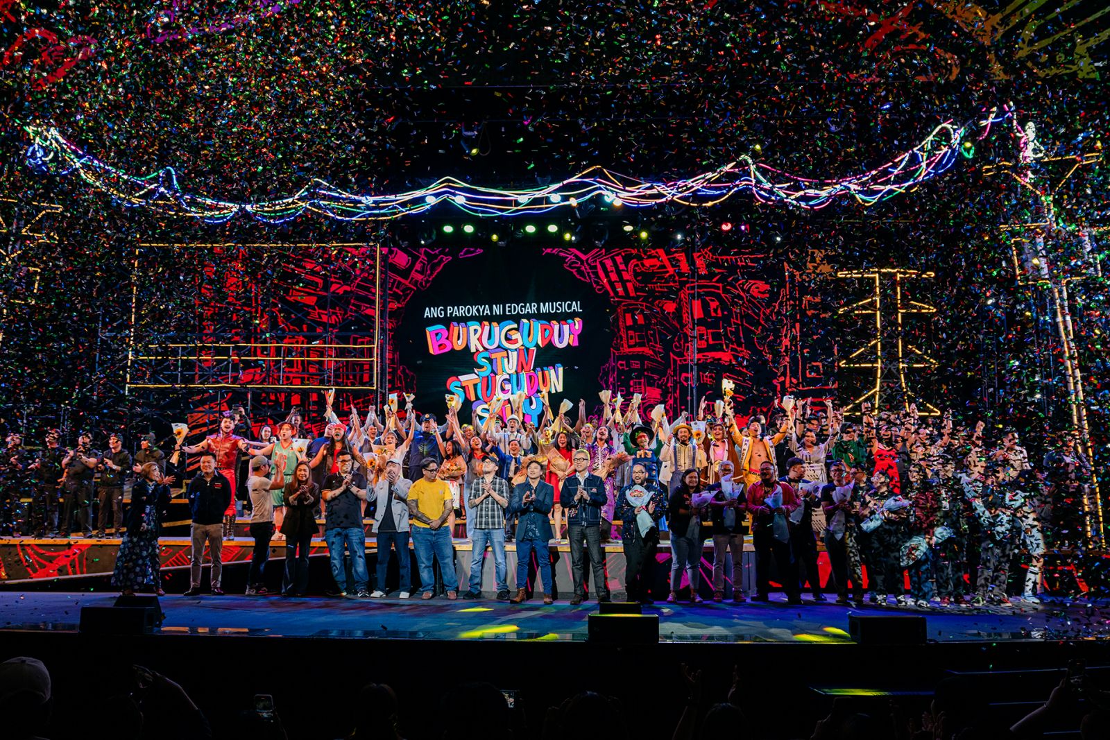 The full cast and crew of Buruguduystunstugudunstuy: Ang Parokya ni Edgar Musical take their bows on stage together with Parokya ni Edgar members and Newport World Resorts executives