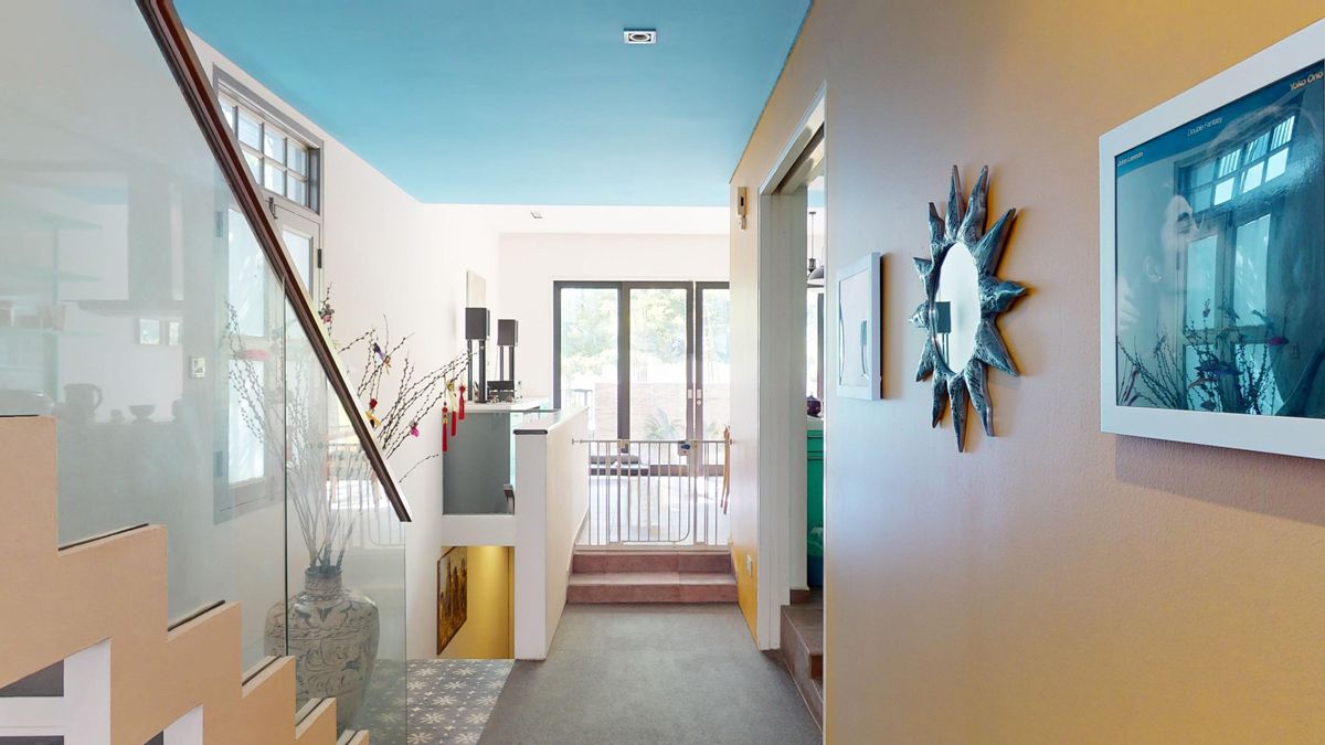 Vivid yellow further illuminates an airy and bright walkway