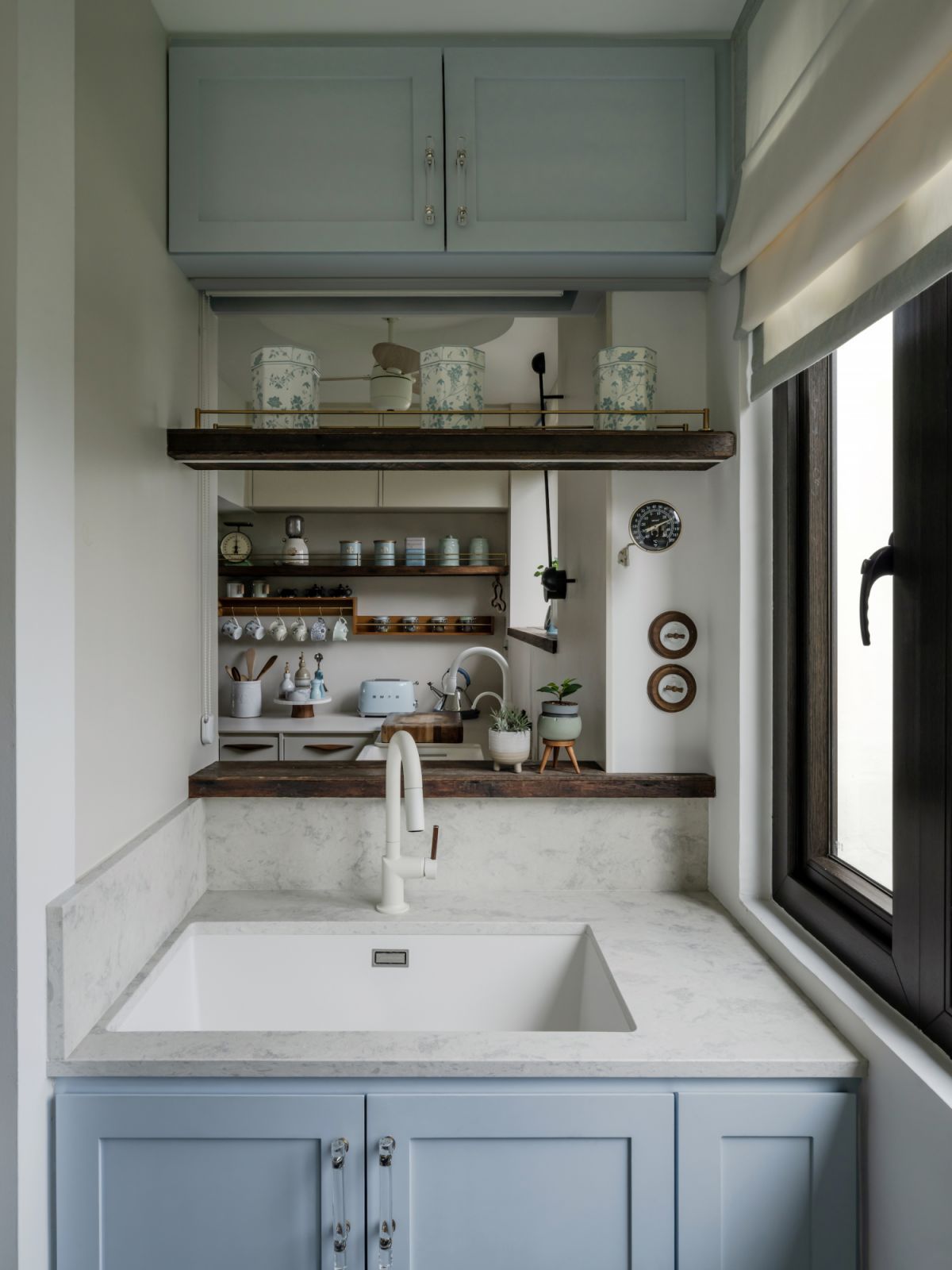 Duck egg blue cabinetry in the kitchen (Photo: David Yeow)