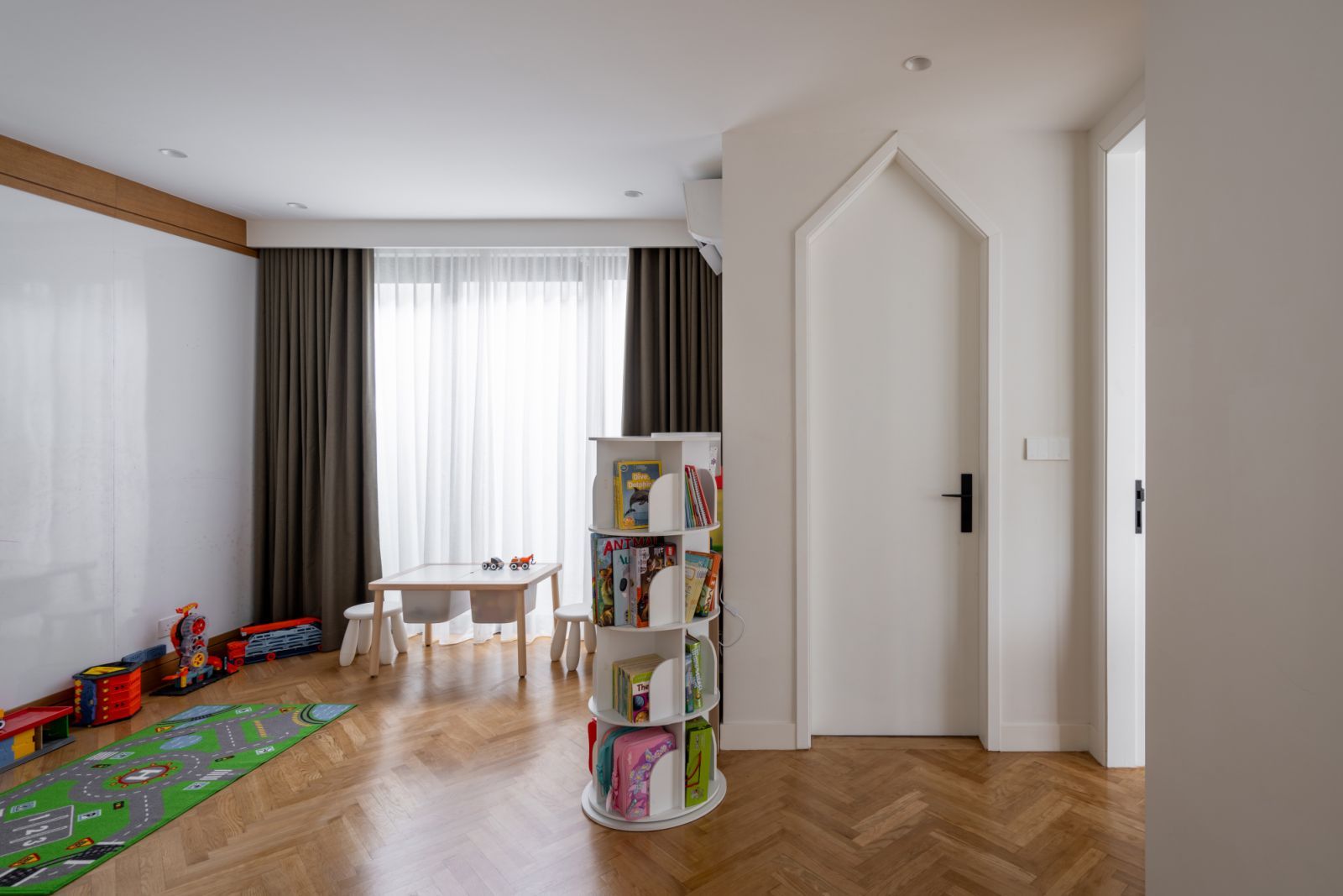 The door frame in the playroom echoes the pitched roof (Photo: BricksBegin)