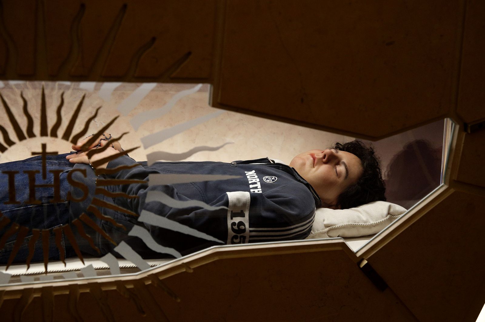 ASSISI, ITALY - OCTOBER 09: (EDITORS NOTE: This image contains graphic content) The tomb of Carlo Acutis in the Church of Santa Maria Maggiore at the eve of the beatification ceremony of Carlo Acutis, on October 09, 2020 in Assisi, Italy. The fifteen-year-old Carlo Acutis member of the Millennial generation, who died on 12 October 2006 from M3 fulminant leukemia, is considered a "computer geek" on account of his passion and skill with computers and the internet. Acutis applied himself to creating a website
