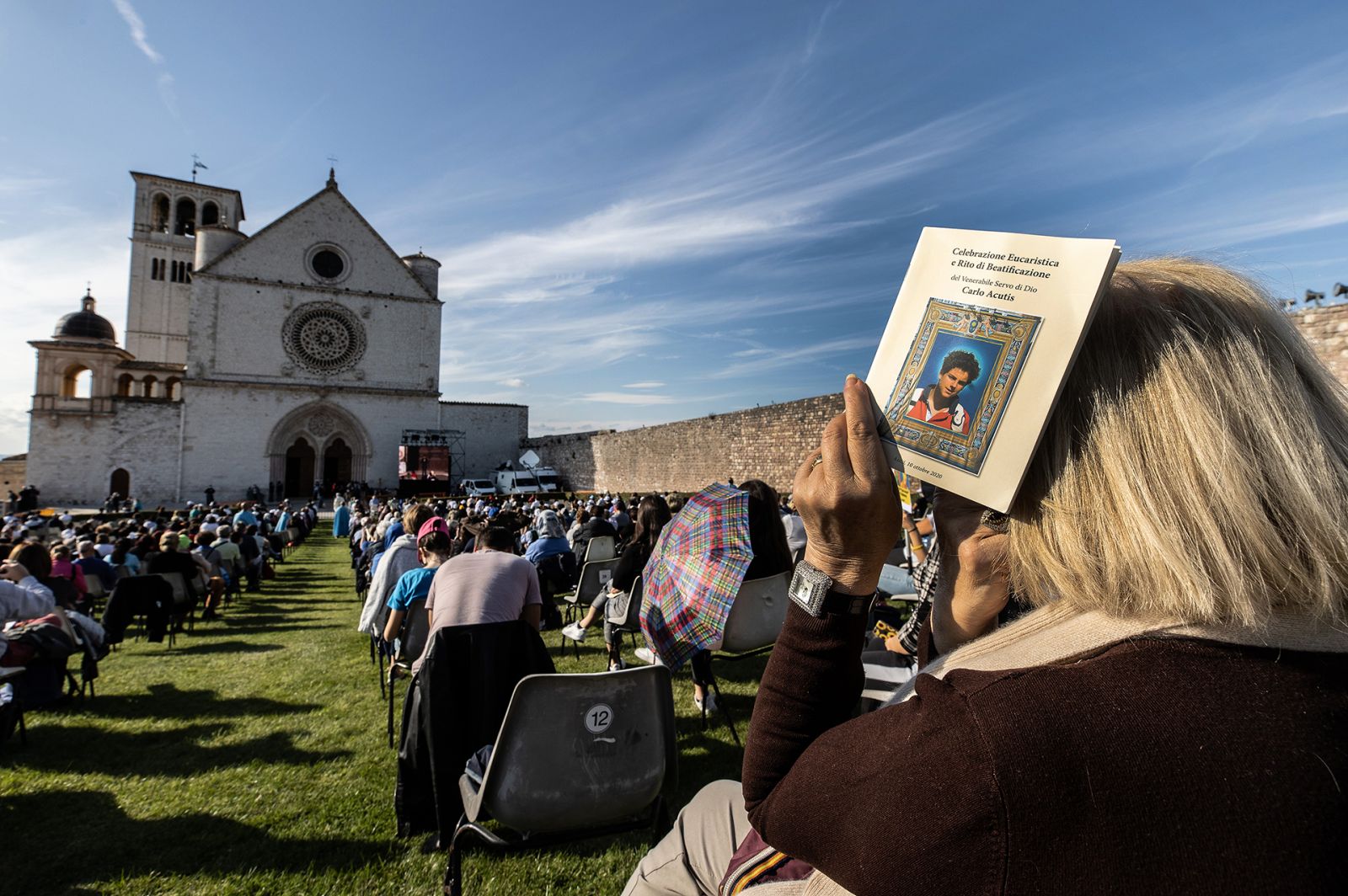 ASSISI, ITALY - OCTOBER 10: Faithful attend the beatification ceremony of Carlo Acutis at the St. Francis Basilica on October 10, 2020 in Assisi, Italy. The fifteen-year-old Carlo Acutis member of the Millennial generation who died on 12 October 2006 from M3 fulminant leukemia, is considered a "computer geek" on account of his passion and skill with computers and the internet. Acutis applied himself to creating a website dedicated to cataloguing each reported Eucharistic miracle in the world. (Photo by Vati