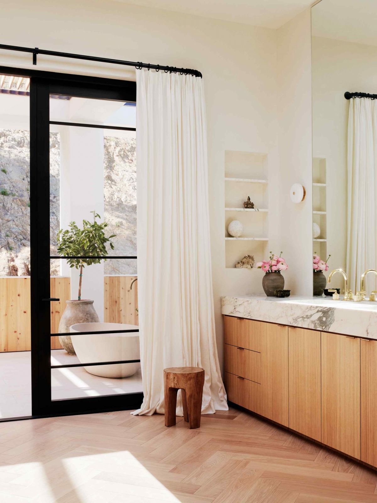 The light-filled master bathroom with an adjoining outdoor spa suite (Photo: Joe Fletcher)