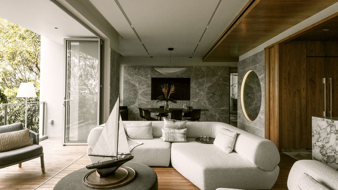 The home’s grand open-plan living area features teakwood flooring designed in the style of a yacht deck