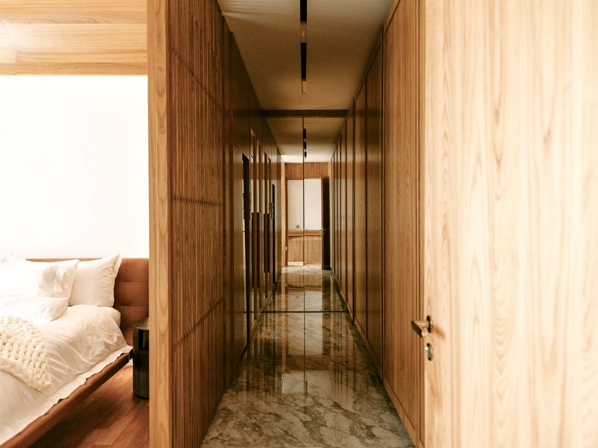 A corridor separates the bedrooms from the main living area