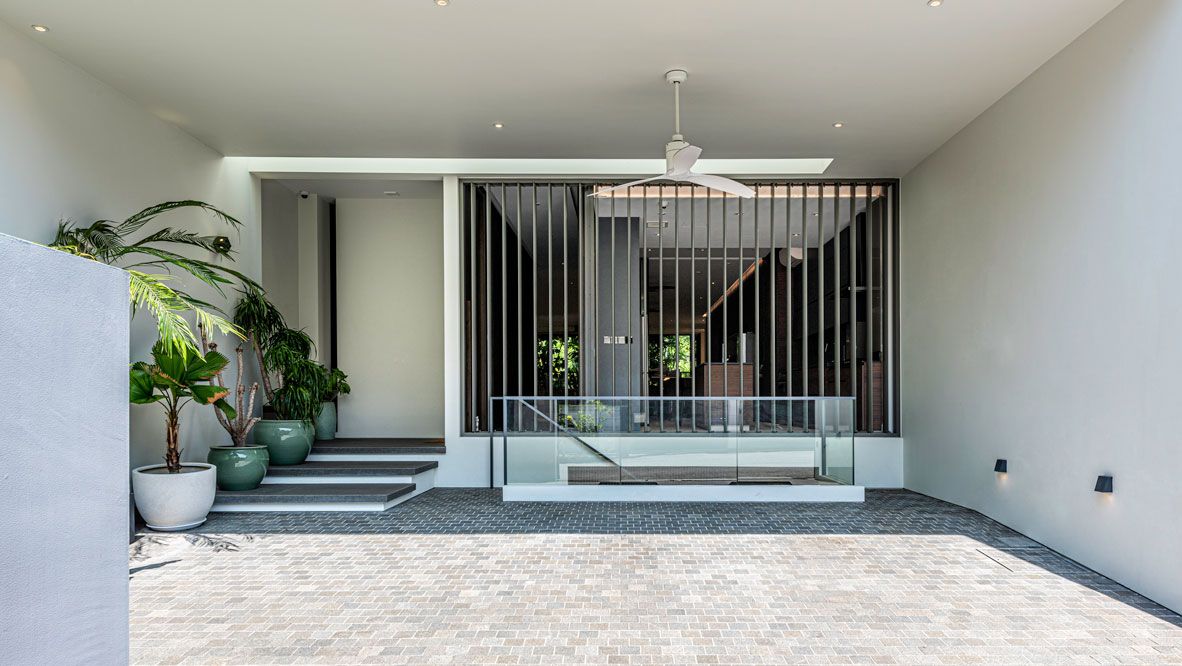 The porous facade of the home designed by Cube Associate Design