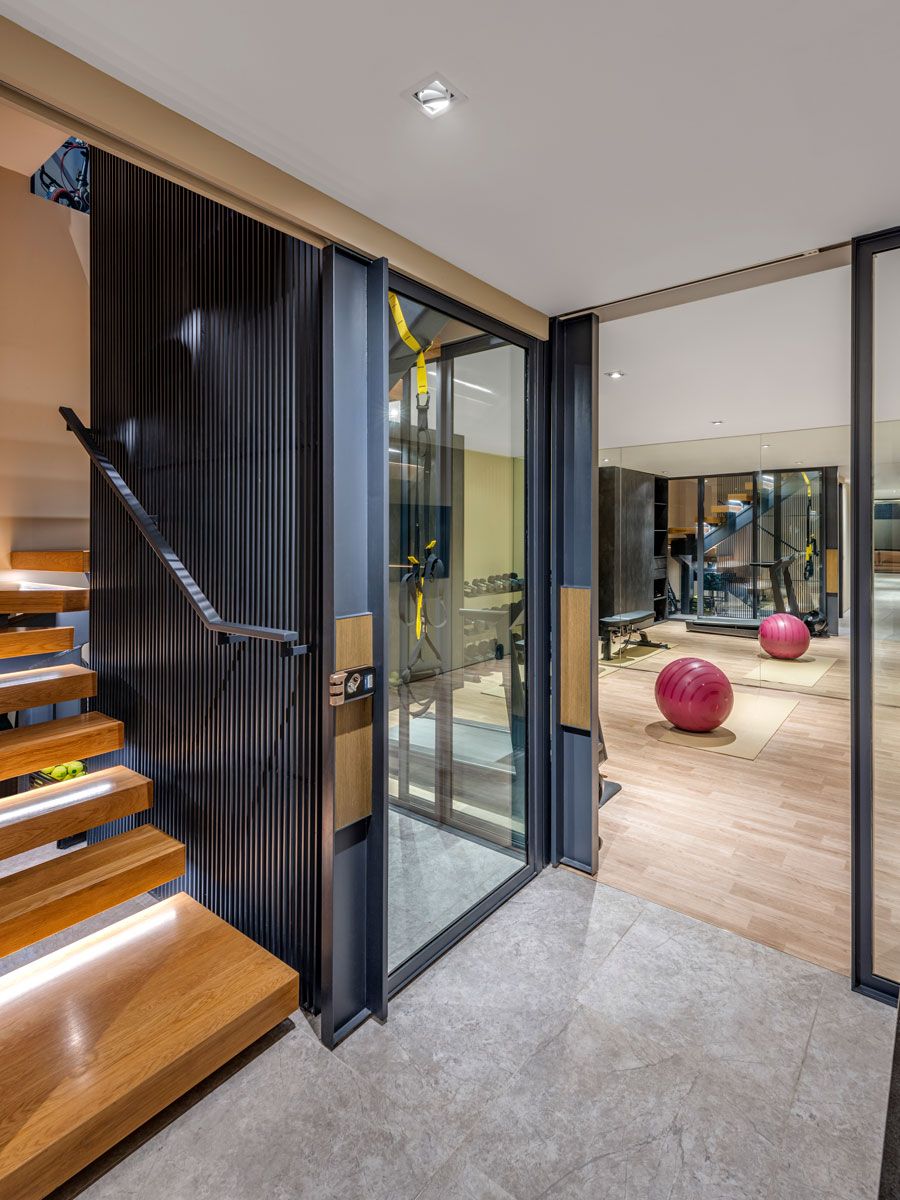 The basement den sports an open-plan layout to house a workout area and also ensure it can be easily adapted to suit the children’s hobbies as they grow older