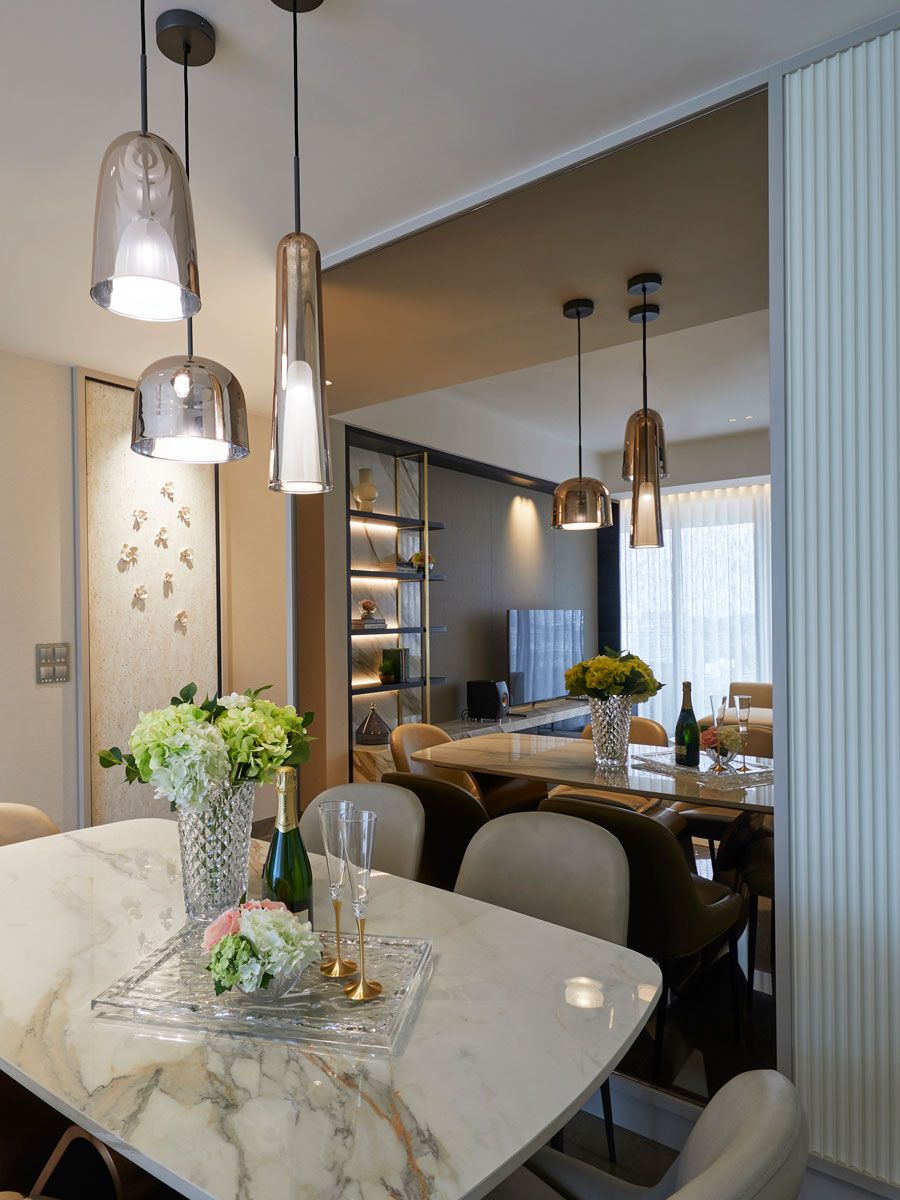 Artusi pendant lights complement this elegant tableau in the dining area
