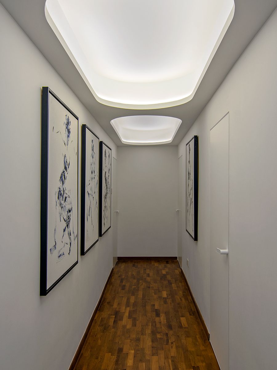 Cove lighting adds visual softness and curved elements to this corridor