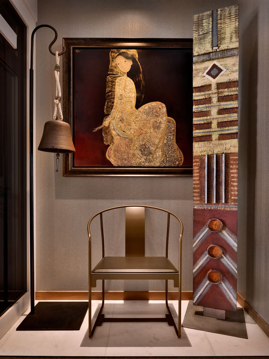 The Driade Mingx chair complements the eclectic mix of art and decor in the entryway
