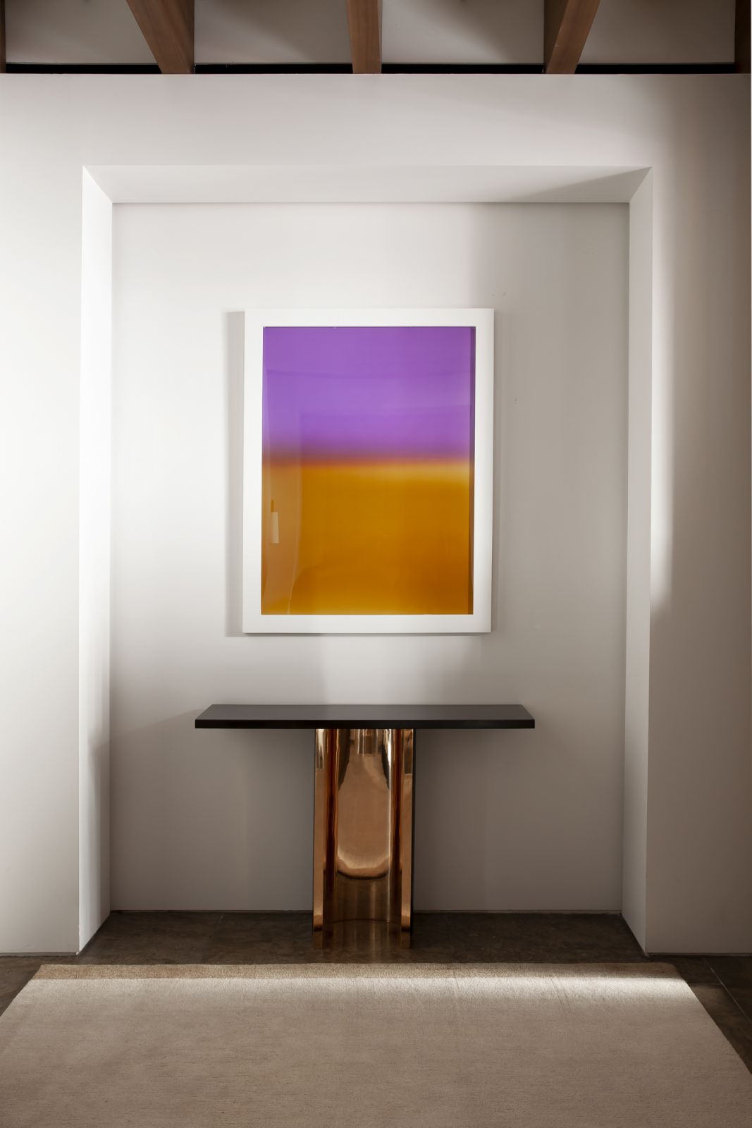 The vibrant artwork lends the muted interiors a much-needed pop of colour (Photo: Sylvie Becquet)