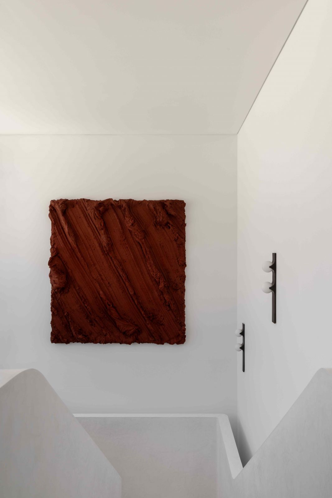 A blood red wall sculpture by Sydney-based artist Henryk