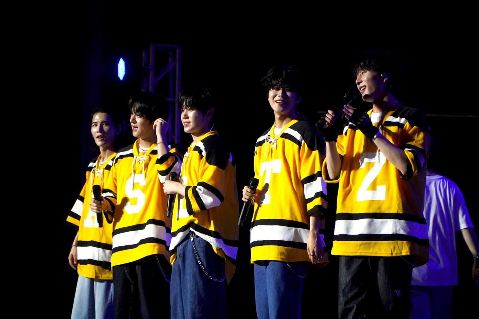 Five-member K-pop boy group Dignity talks to the crowd after performing at SBTown Music Fiesta