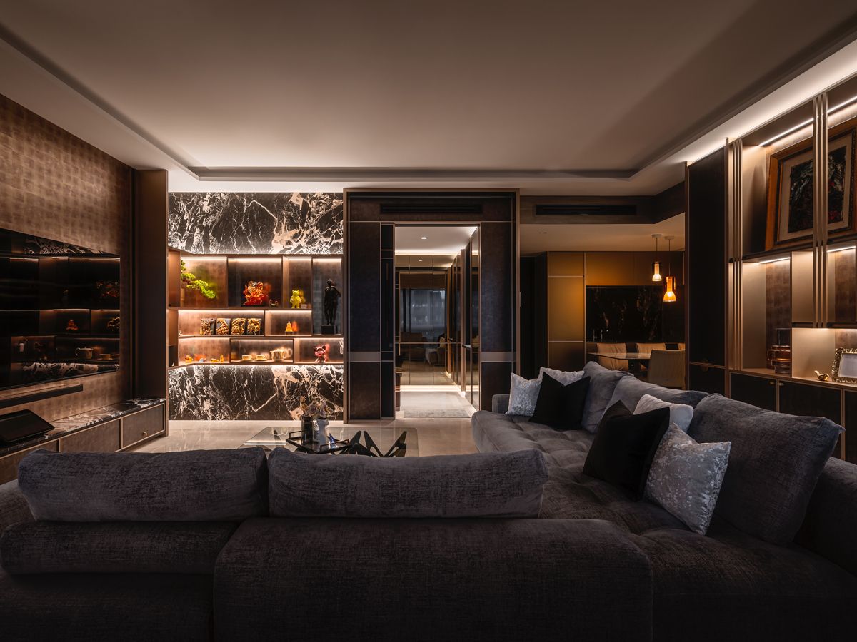 A rich mix of velvet, marble, dark wood and matte-finished metalwork contributes to the handsome look of this home