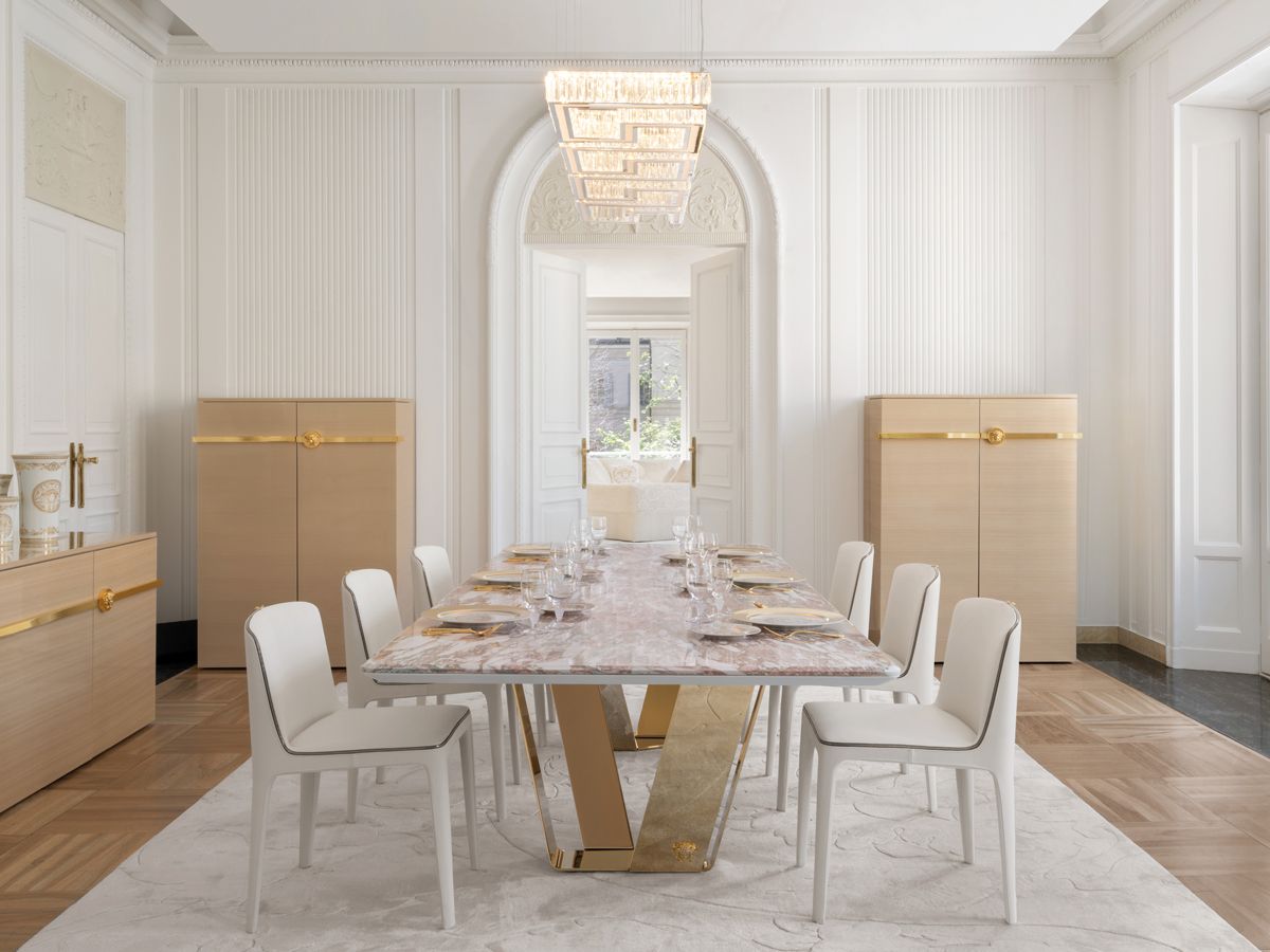 An elegant dining room setting with gold details