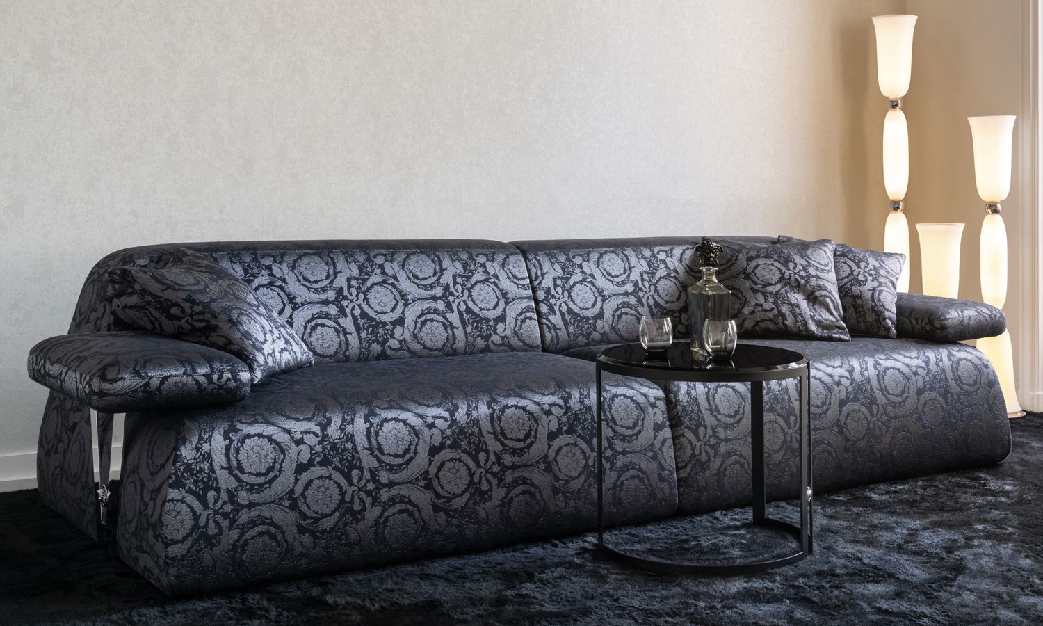 A black-on- black Versace Barocco motif adorns this sofa