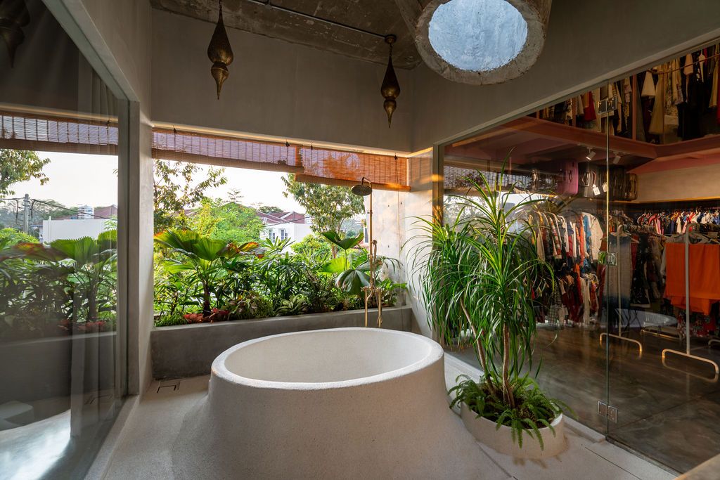 The round bathtub was cast in concrete