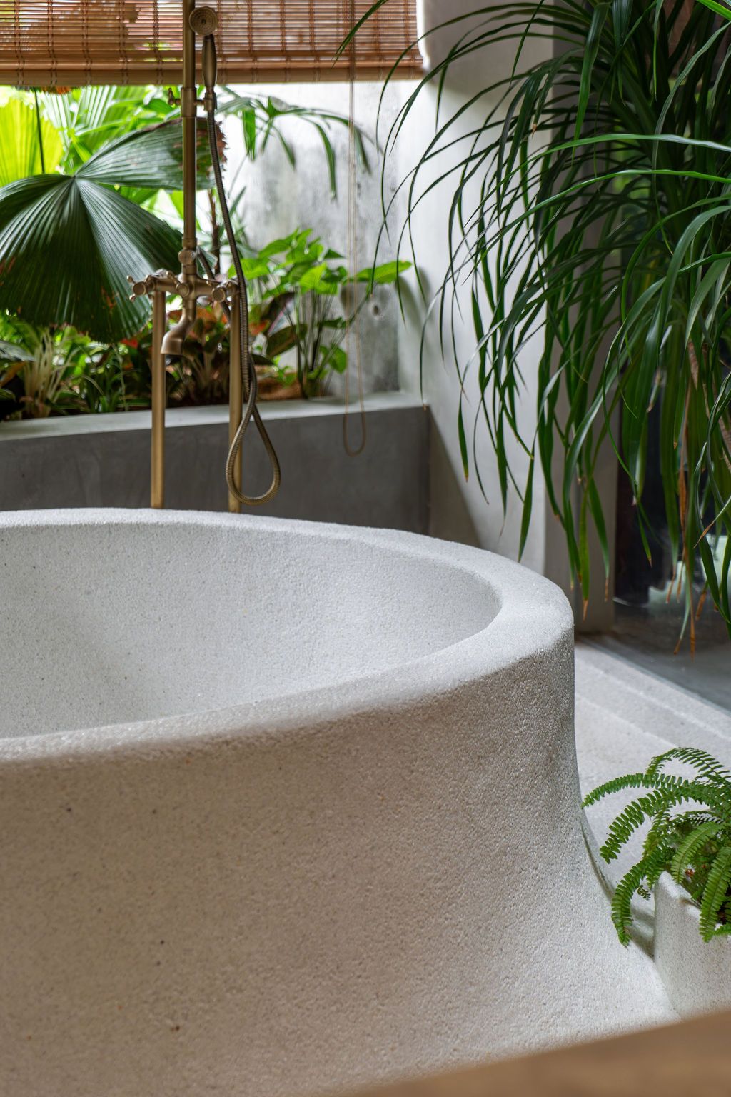 The round bathtub was cast in concrete
