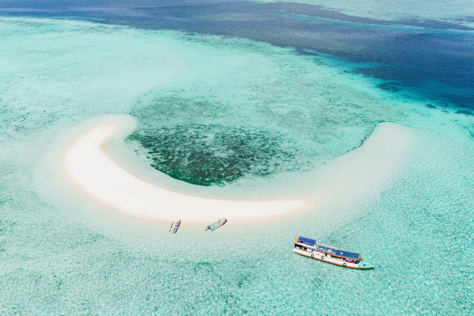 Taka makassar moon shape island in Komodo National Park, Indonesia. Famous and popular travel destination in Asia. Beautiful aquatic world, amazing scenery. Room for copy space