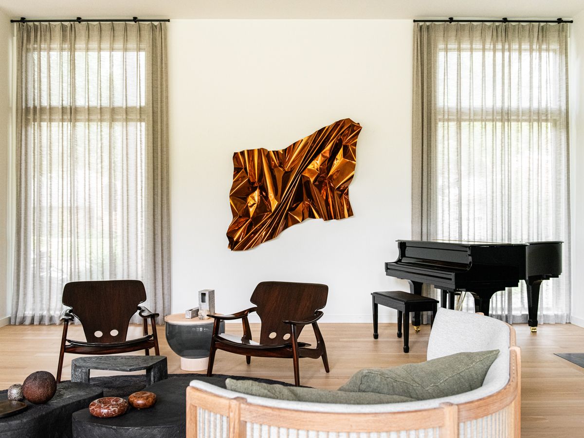 A wall sculpture by Mexican artist Aldo Chaparro brings kinetic energy to this space(Photo: Robert Tsai)