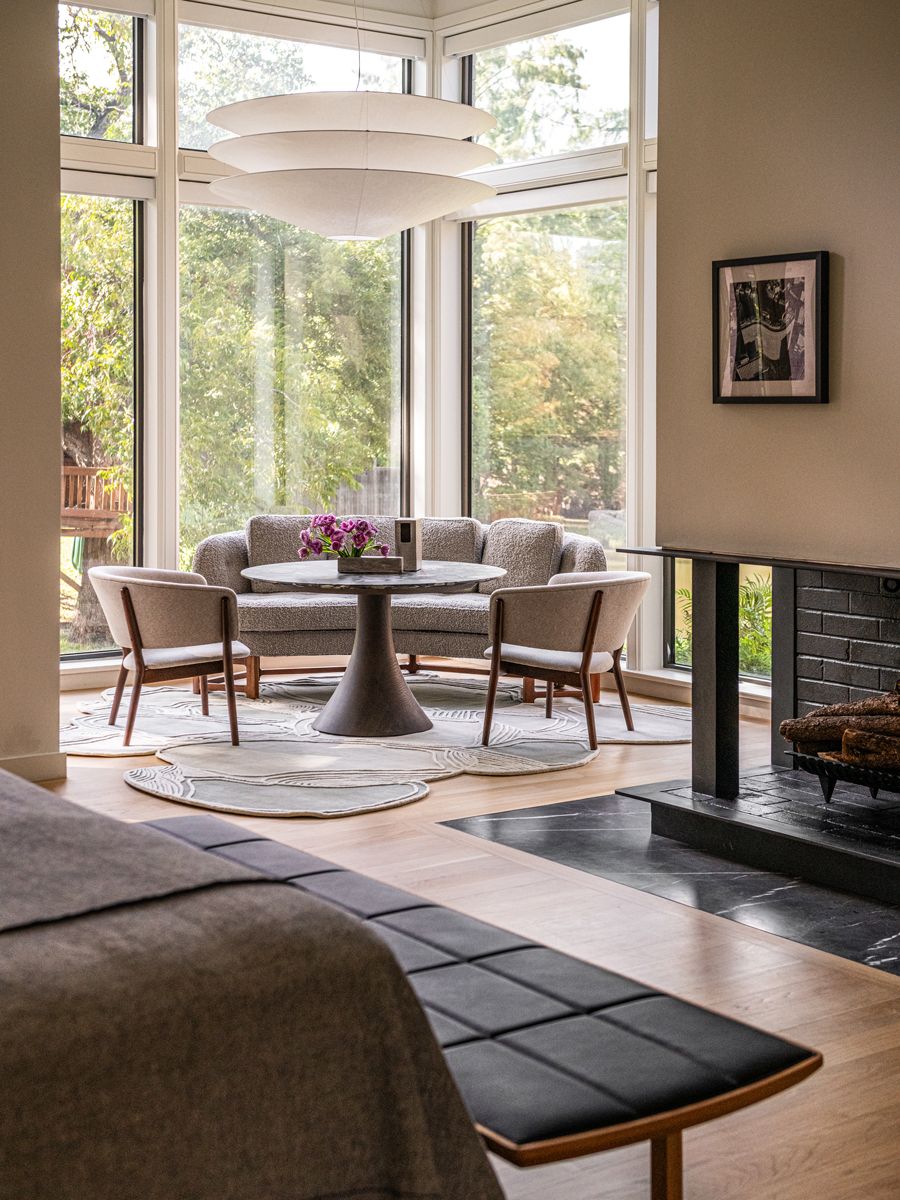 Modernist creations by Nanna Ditzel, Edward Wormley and Jader Almeida harmonise with materials such as blackened steel and dark stone (Photo: Robert Tsai)
