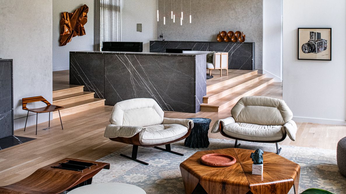 The split-level sunken living room showcases a handful of high-pedigree pieces acquired during the homeowners’ time in Brazil (Photo: Robert Tsai)