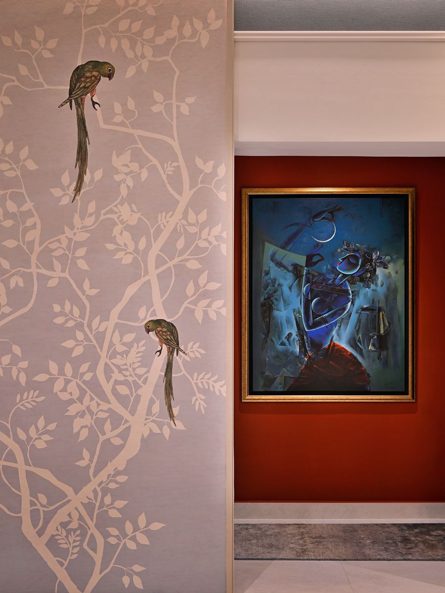 A closer look at the mural in the living room, along with an artwork from the family’s collection