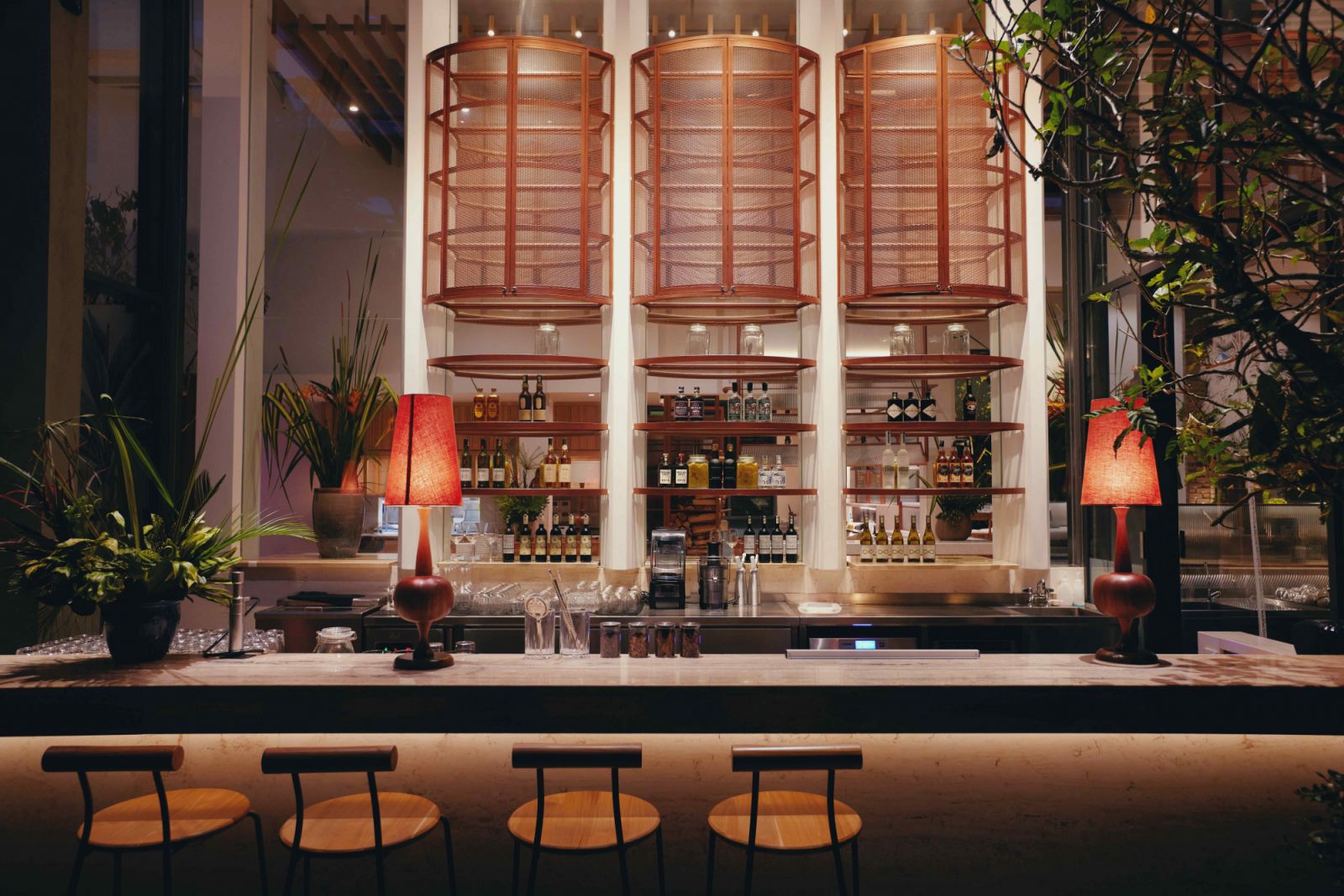 Bar Botanica's marble countertop blends with the rich, earthy tones (Photo: Botanica+Co)