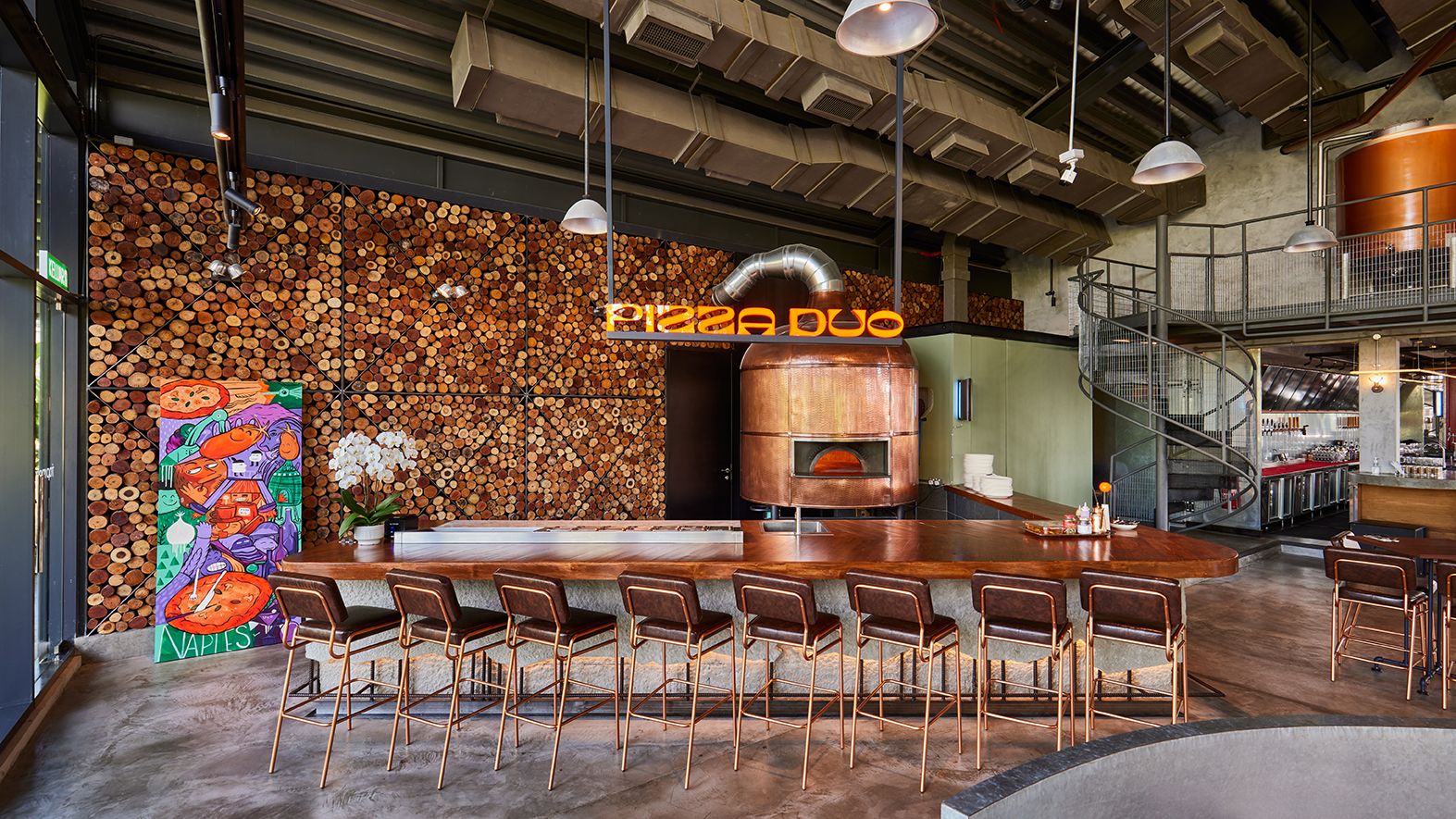 Pizza Duo's custom-built Stefano Ferrara oven against a wood log backdrop (Photo: Tap Room)