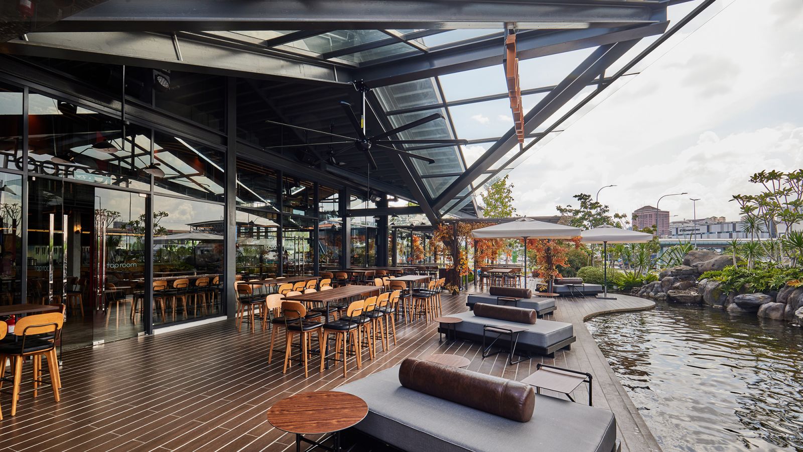 The outdoor seating area flanked by a waterfall (Photo: Tap Room)