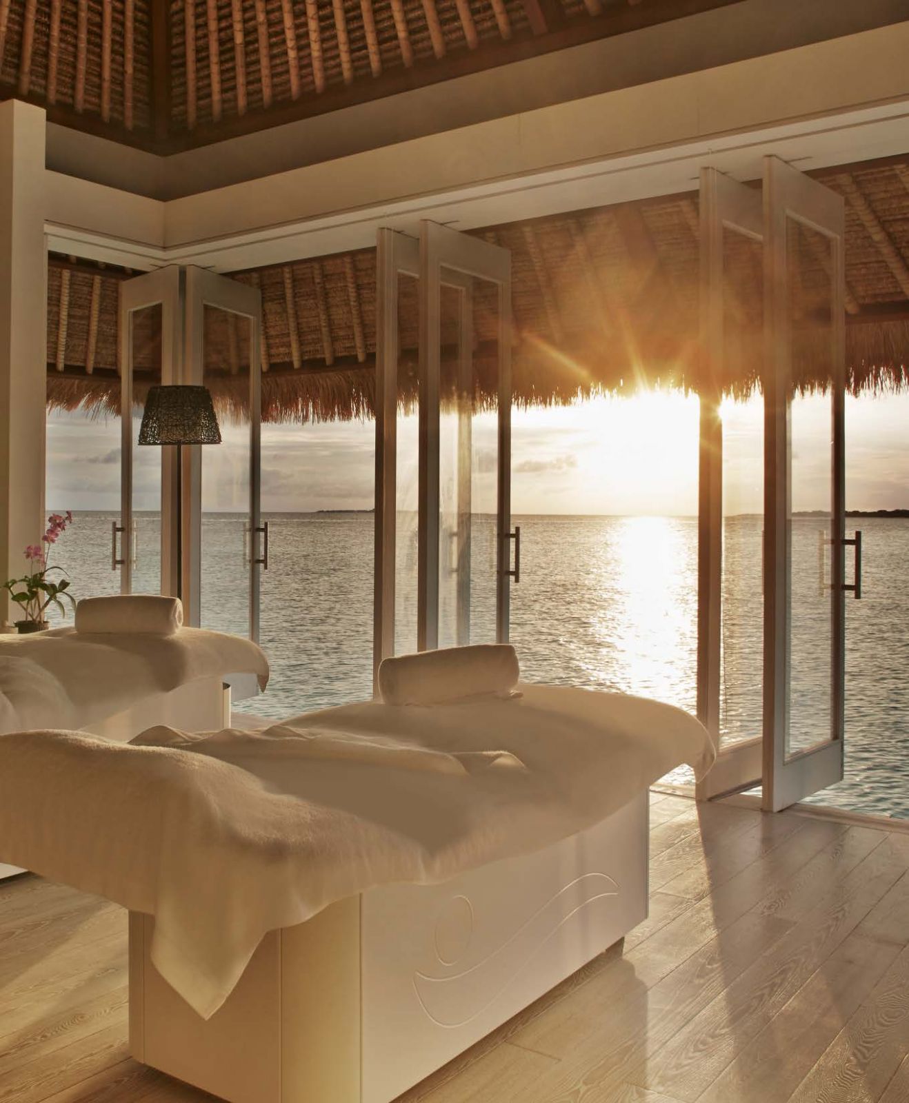 Unwind with a soothing massage as the sun sets over the waves