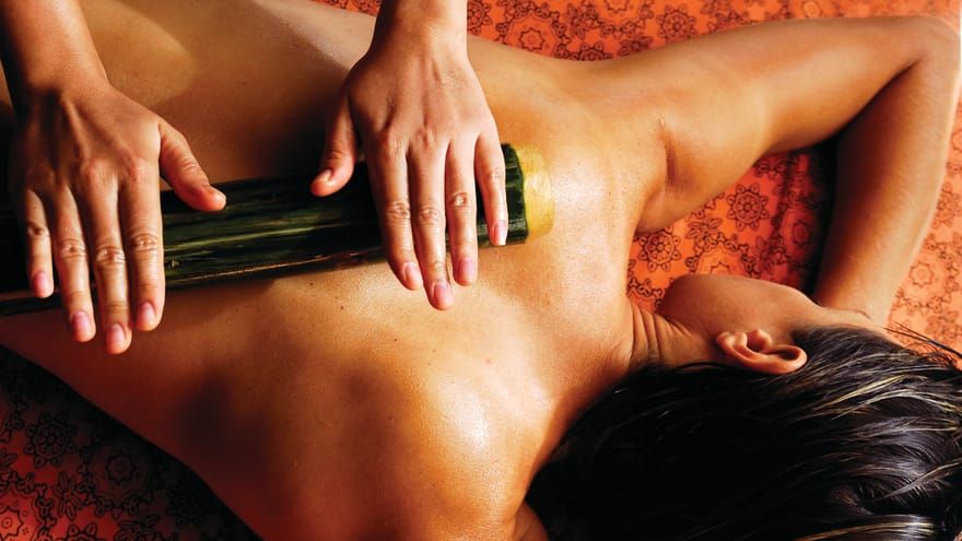 A traditional bamboo massage at Four Seasons Thailand
