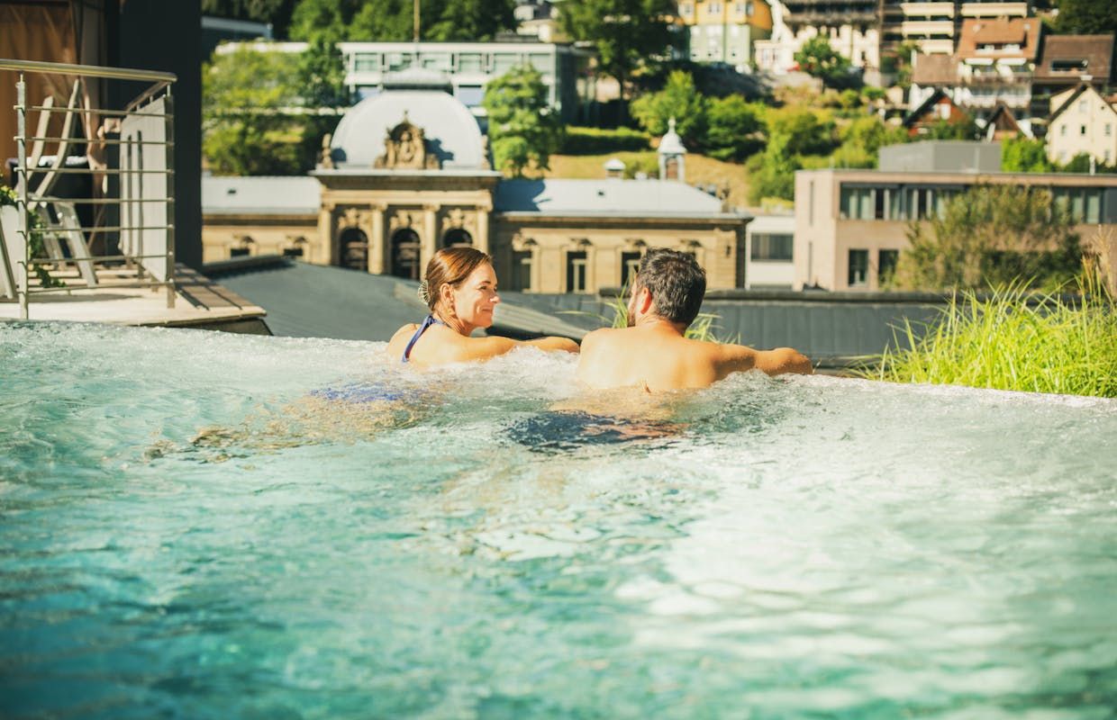 The outdoor basin offers views over the German town