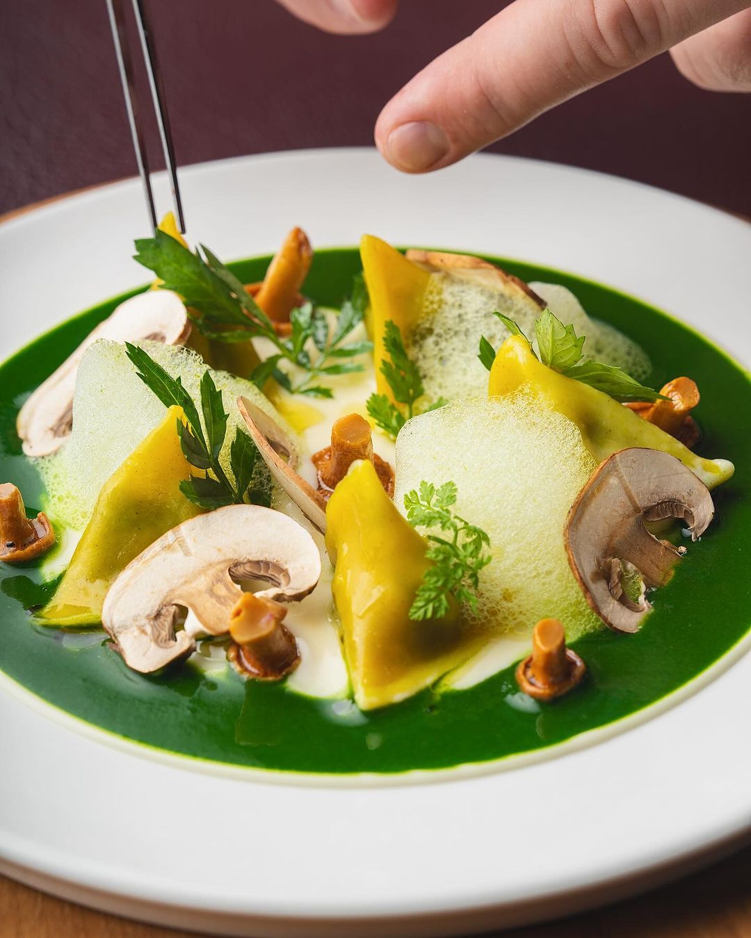 Escargot berlingots with garlic puree and pickled chanterelles (Photo: Instagram / @entierfrenchdining)