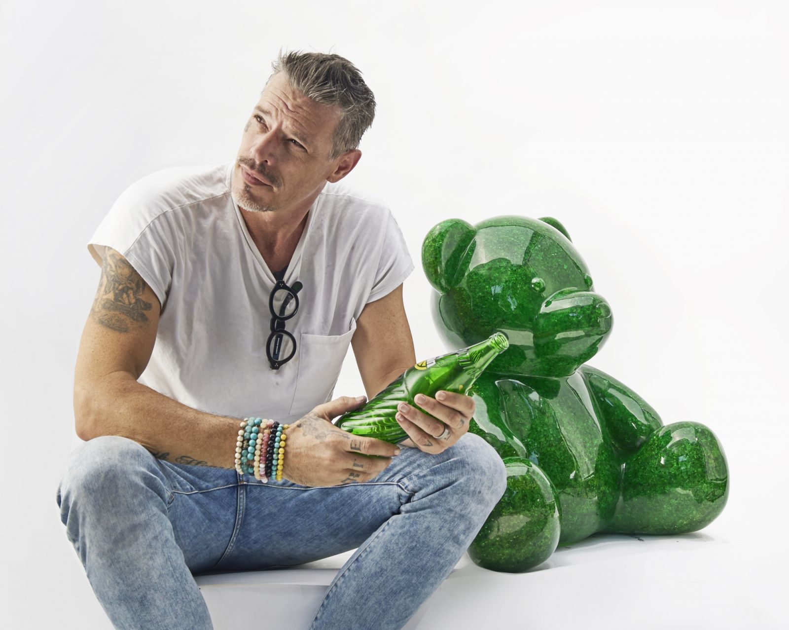 Dutch pop artist and sculptor Dominik Haring with the ‘Sodapop Bear’, made from thousands of crushed glass soda bottles that represent his vision of transforming fragmented moments into a unified whole