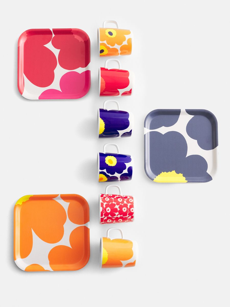 A flatlay of Marimekko's 60th anniversary collectible products featuring the Unikko print, one of the brand's most popular prints
