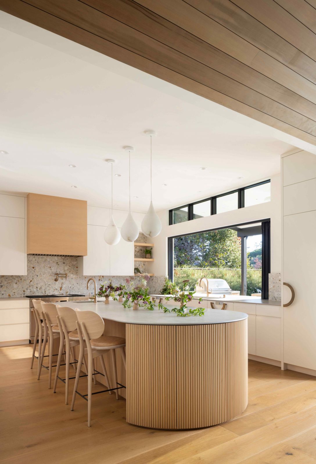 The bi-fold windows are a seamless indoor-outdoor integration