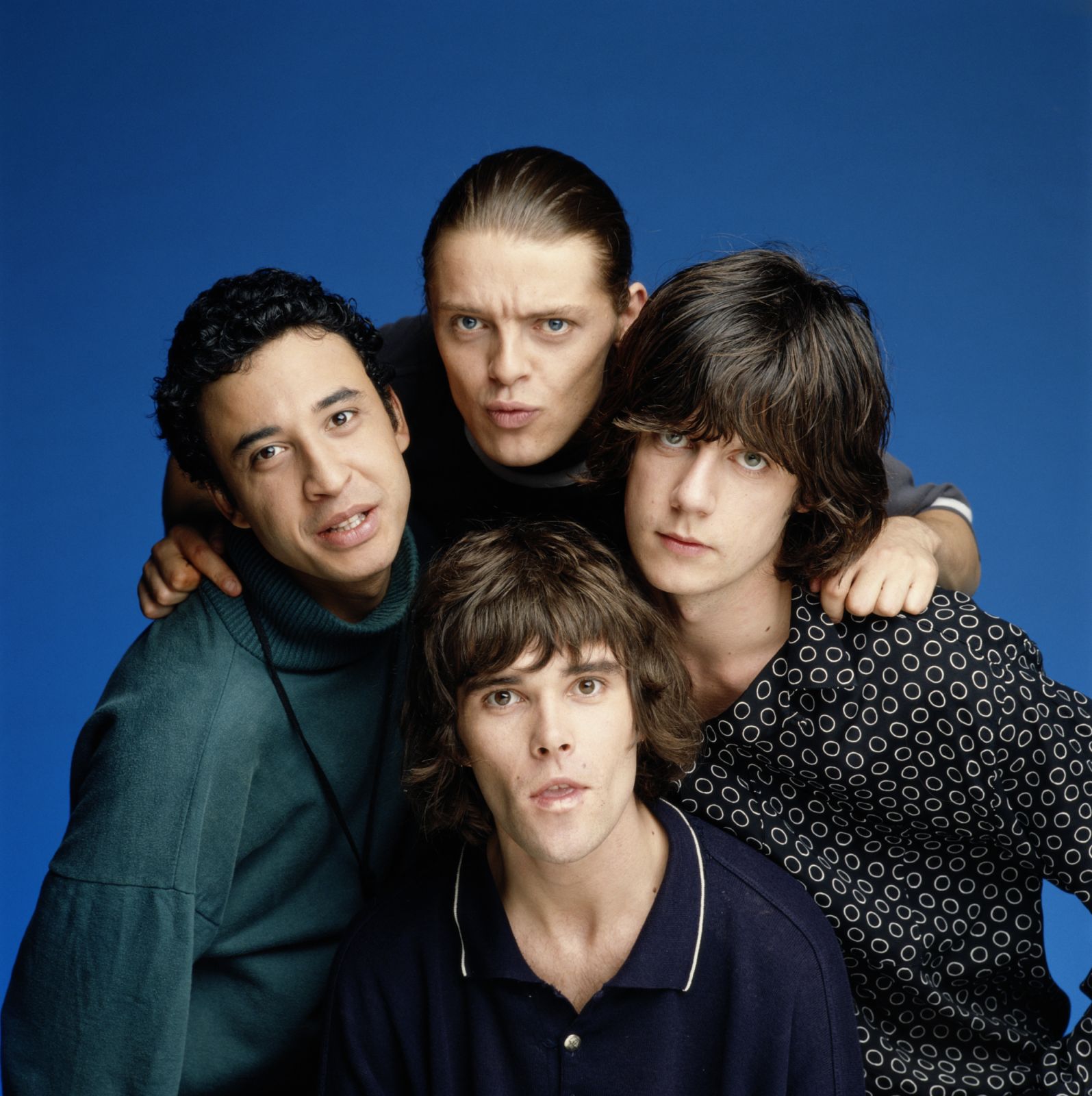 LONDON - JULY 01: The Stone Roses posed in a London studio in July 1990 L-R Reni, Mani (top) Ian Brown (bottom) John Squire (Photo by Mike Prior/Getty Images)