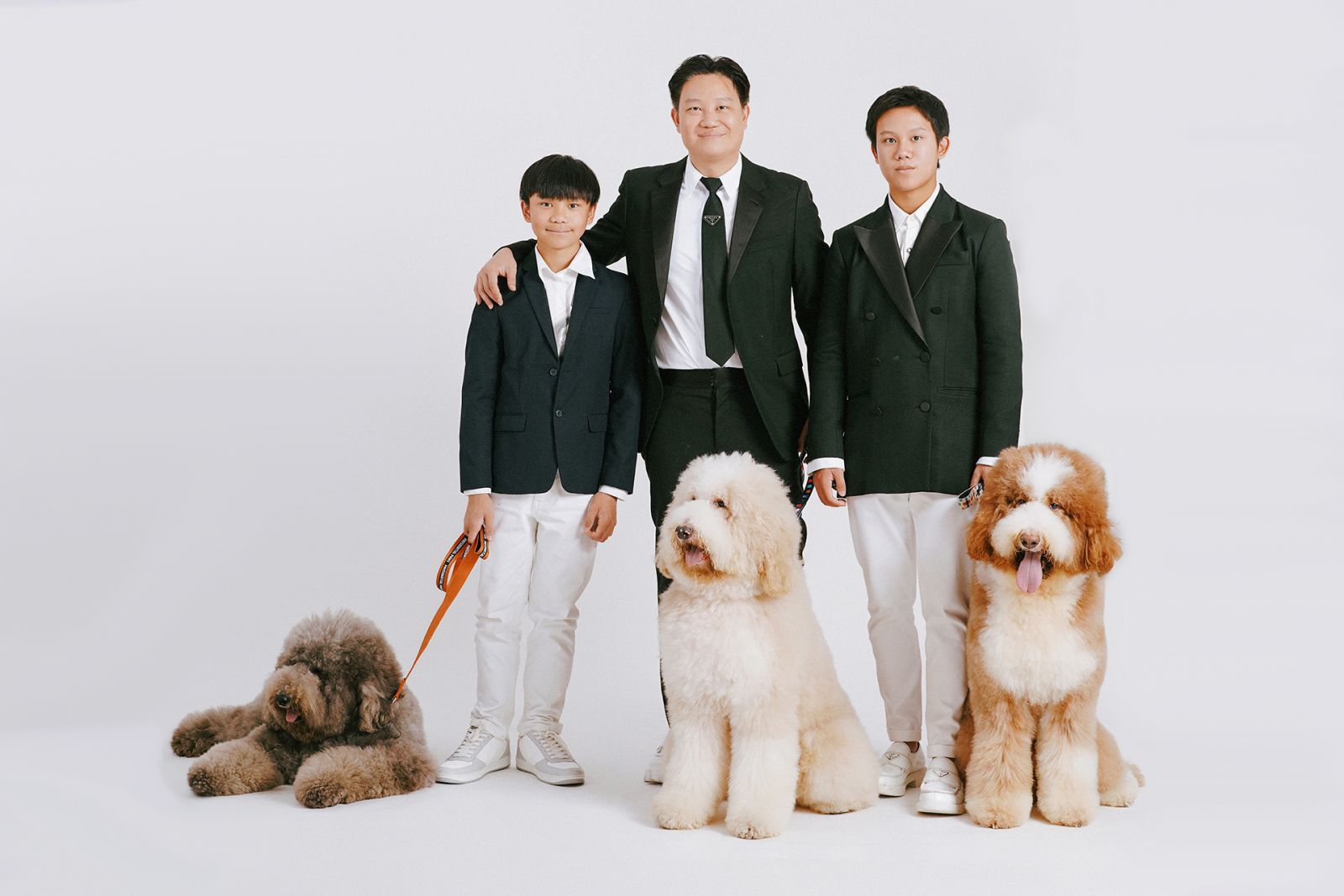 Dr Z Teo with his sons Kenzo and Ken-Z, and their giant poodles (Photo: Patrick Diokno)