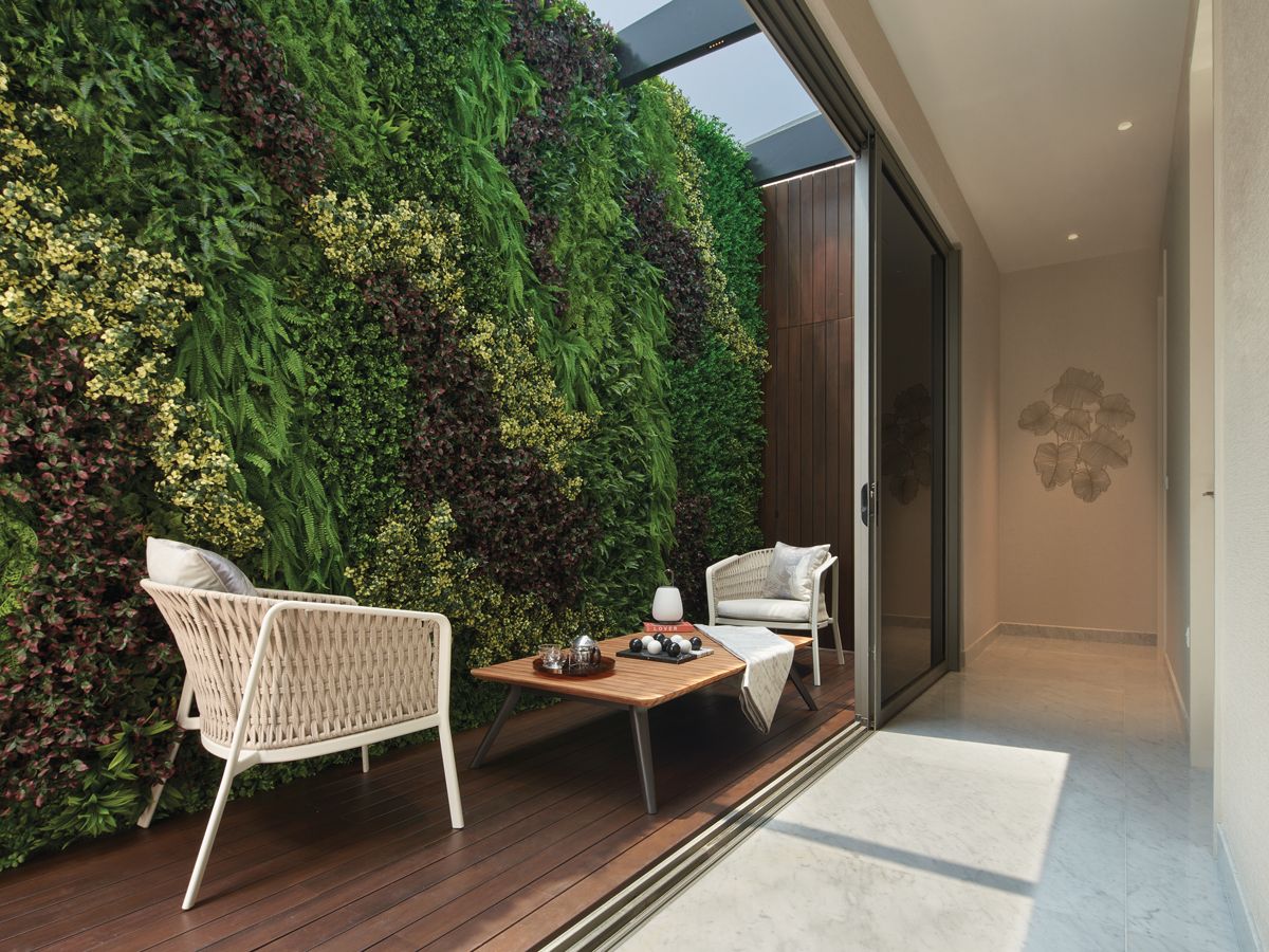 This enclosed terrace area provides a pocket of greenery within the home (Photo: Benny Loh)