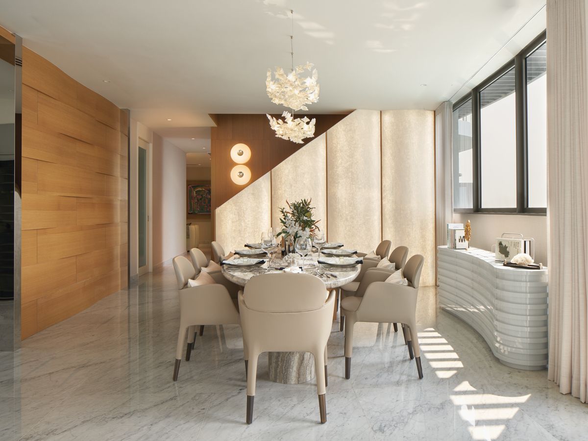 Illuminated wall panels create a striking backdrop in the elegant dining area (Photo: Benny Loh)