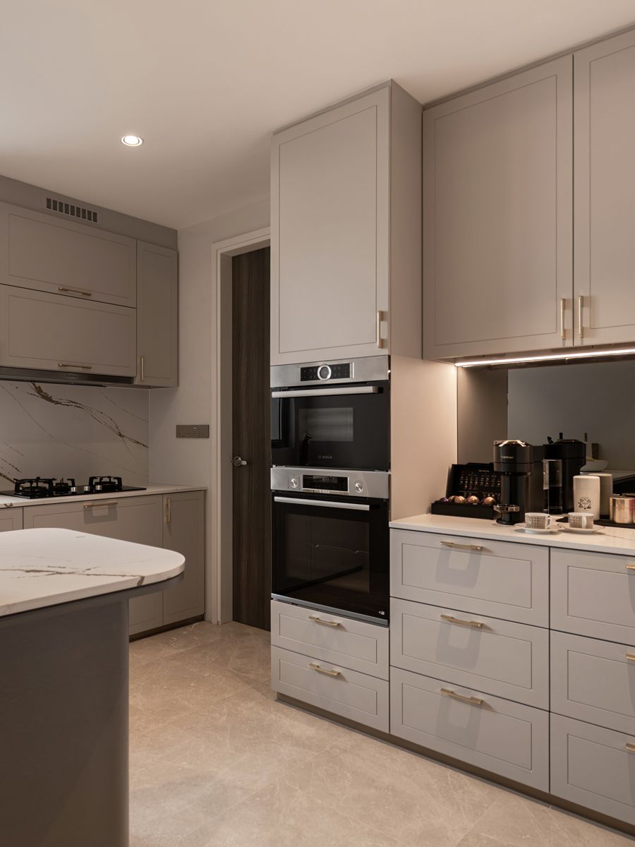 This stylish yet functional kitchen features a striking marble backsplash and countertop (Photo: Mr Shopper Studio)