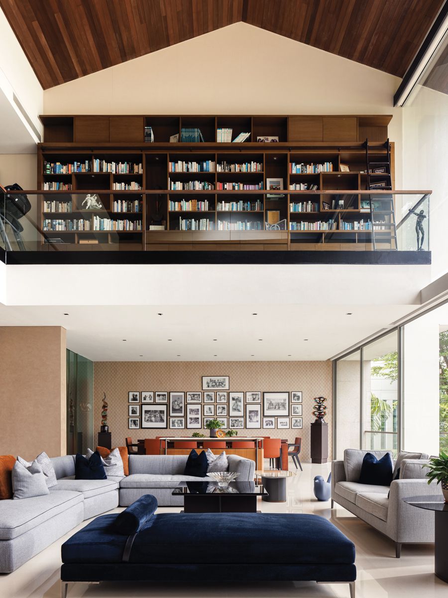 A view of the library area on the mezzanine from the living room (Photo: Designworx Interior Consultant)