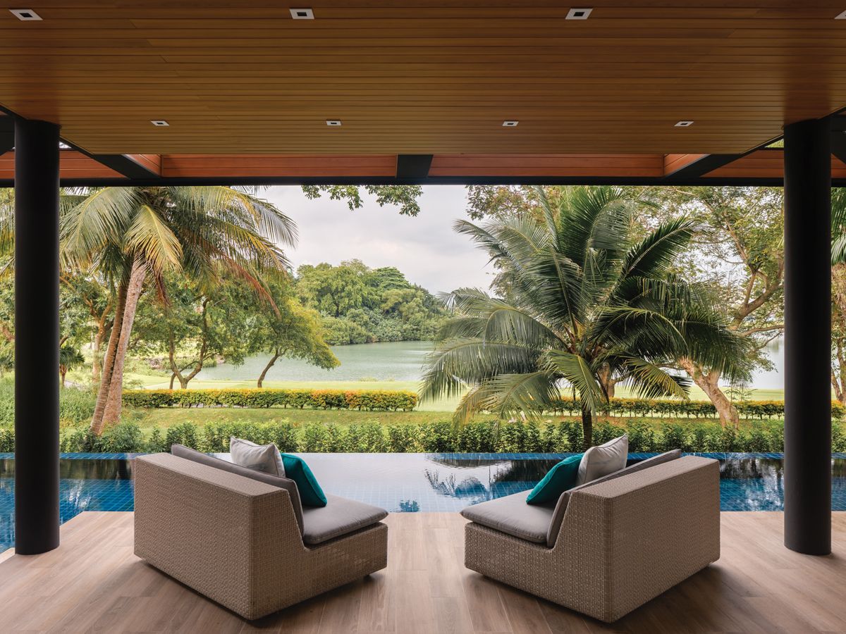 The poolside terrace looks out to soothing views of the golf green (Photo: Designworx Interior Consultant)