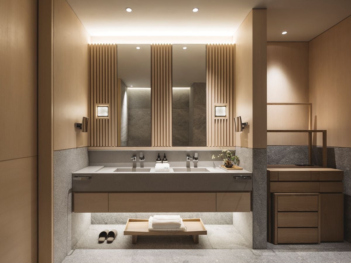 A dressing area and a spacious double-basin vanity in the master bathroom provide everything that the wife needs to get ready for the day (Photo: Max Lim)