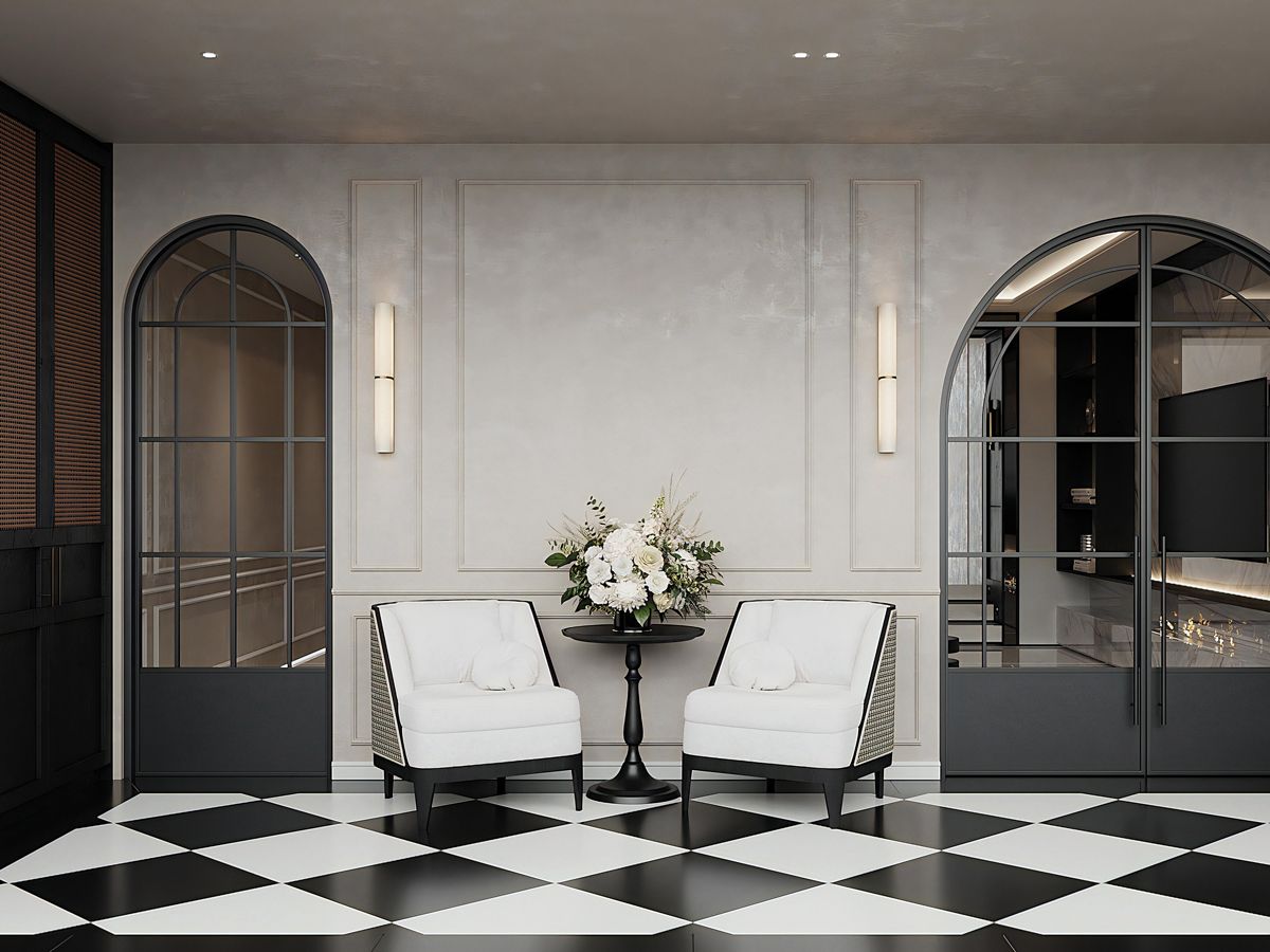 A pair of arched glass doors and the diamond patterned tiling in the entryway add to the home’s classic look (Photo: LA Design Studio)