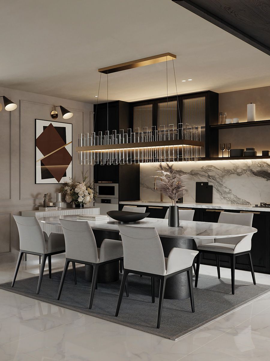 Gilded details on the art and lighting fixtures contribute to the stylish look of the dining area (Photo: LA Design Studio)