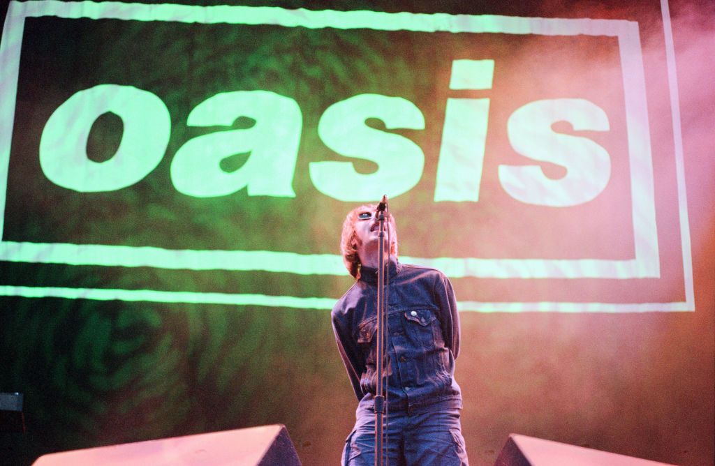 Liam Gallagher of Oasis, music group, performing on stage, Balloch Castle Country Park Balloch, Loch Lomond, in West Dunbartonshire, Scotland, 4th August 1996. (Photo by Runnacles/Gunion/Mirrorpix/Getty Images)