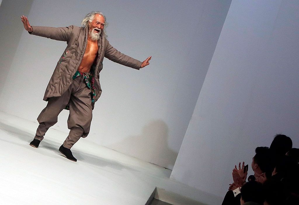 Artist and actor Wang Deshun walks the runway during the Sheguang Hu show as part of Mercedes-Benz China Fashion Week 2015/2016 Autumn/Winter Collection at Central Hall on March 25, 2015 in Beijing, China. (Photo by Quan Yajun/Visual China Group via Getty Images)