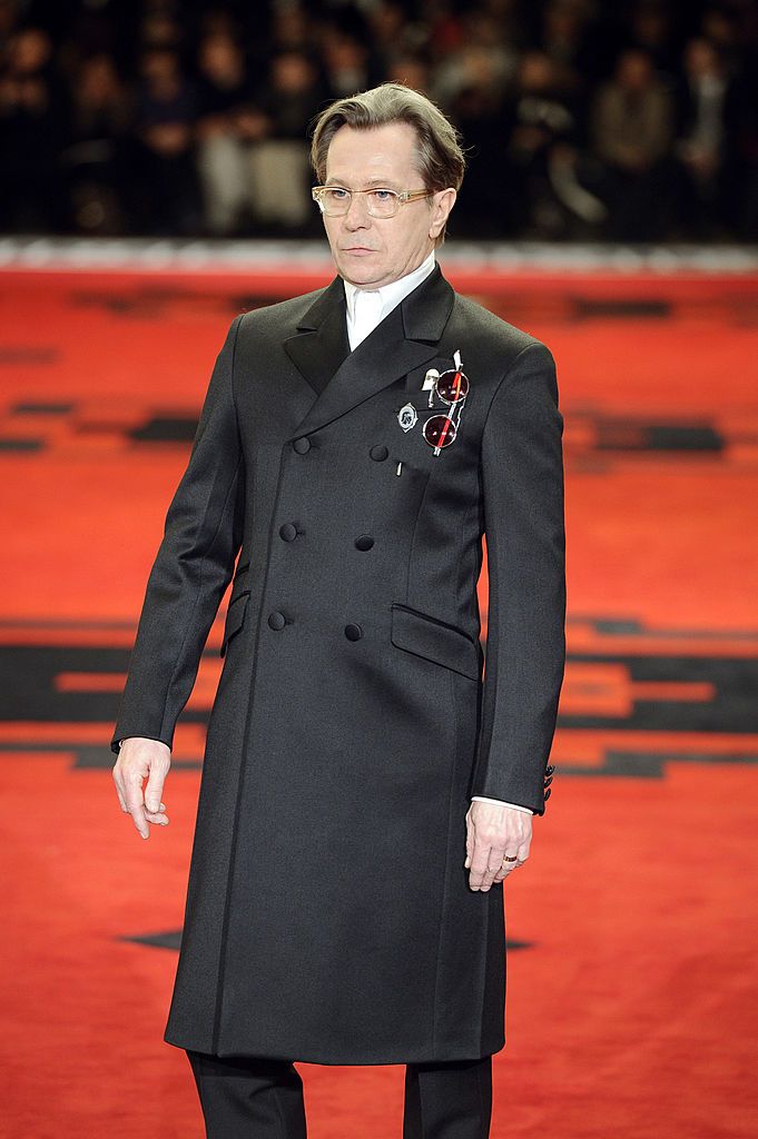 Actor Gary Oldman walks the runway at the Prada Autumn Winter 2012 fashion show during Milan Menswear Fashion Week on January 15, 2012 in Milan, Italy.  (Photo by Chris Moore/Catwalking/Getty Images)